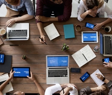 Our team gathered around a table brainstorming the best way to help you.