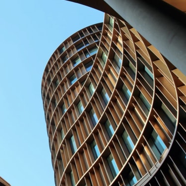 A picture of a building with curved sides.